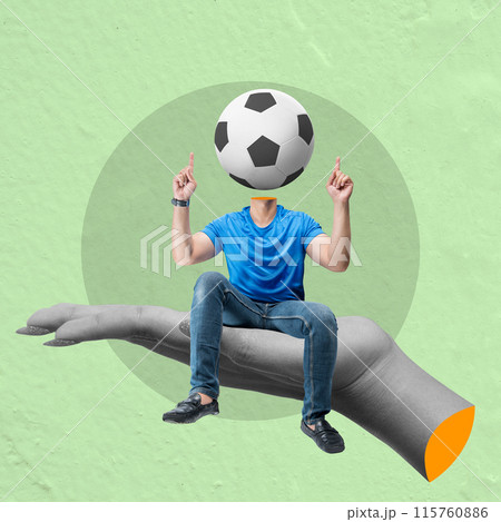Man with soccer ball head sitting on giant hand pointing up with fingers 115760886