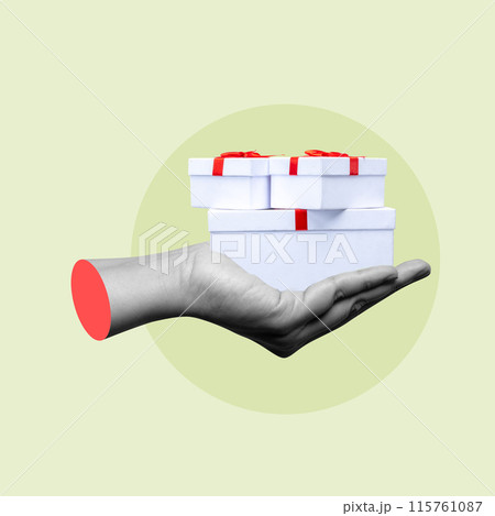 Hand holding stack of white gift boxes with red ribbon on green background 115761087