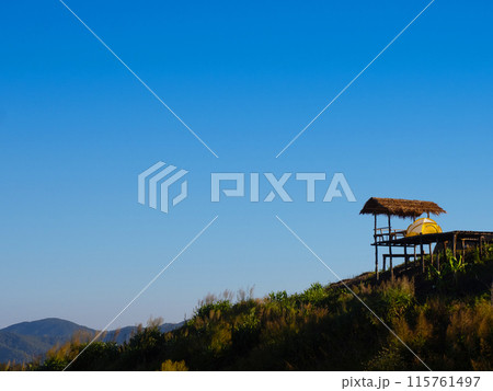 Camping tent and cottage on grass hill with clear sky background. Chiang Mai - Thailand Camping tent and cottage on grass hill with clear sky background. Chiang Mai - Thailand 115761497