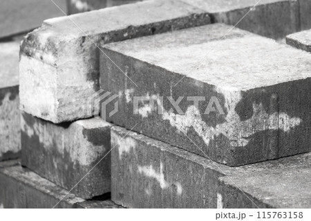 Gray paving slabs lay stacked at construction site. Close-up photo 115763158