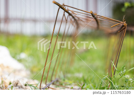 Reinforcement cage lay on green grass at construction site Reinforcement cage lay on green grass at construction site 115763180