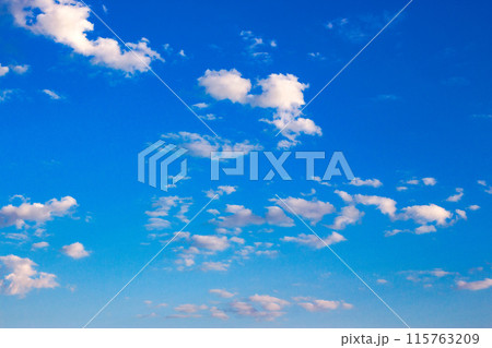 white cumulus clouds on a blue sky. wonderful nature background of fresh air condition in morning light. bright weather forecast. clear atmosphere 115763209