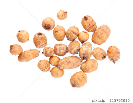 Tiger nuts isolated on white background. Pile of chufa nuts, earth almond or chufa sedge. Cyperus esculentus. Top view. Tiger nuts isolated on white background. Pile of chufa nuts, earth almond or chufa sedge. Cyperus esculentus. Top view. 115765030