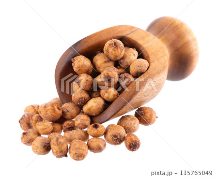 Tiger nuts in wooden scoop, isolated on white background. Pile of chufa nuts, earth almond or chufa sedge. Cyperus esculentus. 115765049