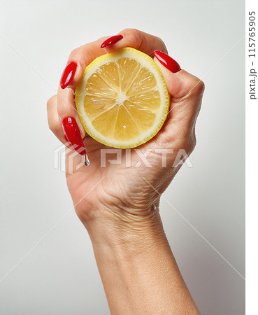 Fresh Lemon Squeeze Studio Shot 115765905