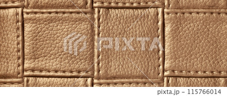 Texture of brown leather background with square pattern and stitch, macro. Abstract backdrop from bronze textile 115766014