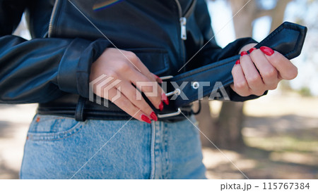 Woman Closing The Zip Of Her Jacket  115767384