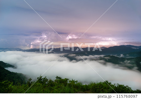 On a summer night, the sea of clouds surges and lightning flashes. On a summer night, the sea of clouds surges and lightning flashes. 115768097