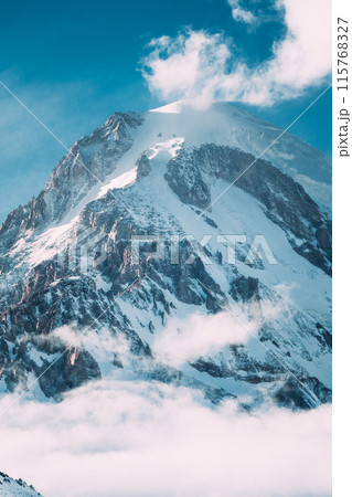 Georgia. Peak Of Mount Kazbek Covered With Snow. Kazbek Is A Stratovolcano And One Of Major Mountains Of Caucasus. Beautiful Georgian Nature Landscape In Early Winter. 115768327