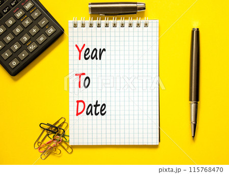 YTD year to date symbol. Concept words YTD year to date on beautiful white note. Beautiful yellow background. Black calculator. Business YTD year to date concept. Copy space. YTD year to date symbol. Concept words YTD year to date on beautiful white note. Beautiful yellow background. Black calculator. Business YTD year to date concept. Copy space. 115768470