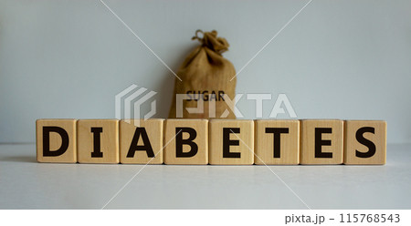 Concept word 'diabetes' on wooden cubes on a beautiful white table. Large canvas bag with word 'sugar'. Beautiful white background, copy space. Medical concept. 115768543
