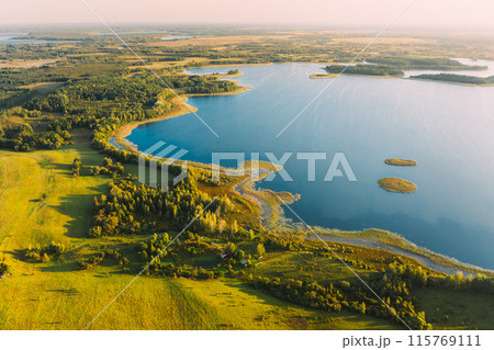 Braslaw Or Braslau, Vitebsk Voblast, Belarus. Aerial View Of Nedrava Lake, Green Forest And Meadow Landscape In Sunny Autumn Morning. Top View Of Beautiful European Nature From High Attitude. Bird's Braslaw Or Braslau, Vitebsk Voblast, Belarus. Aerial View Of Nedrava Lake, Green Forest And Meadow Landscape In Sunny Autumn Morning. Top View Of Beautiful European Nature From High Attitude. Bird's 115769111