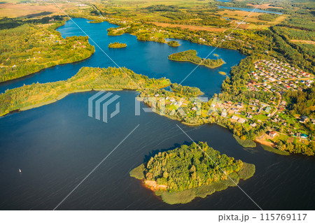 Lyepyel District, Lepel Lake, Beloozerny District, Vitebsk Region. Aerial View Of Residential Area With Houses In Countryside. Top View Of Island From High Attitude In Autumn Sunny Day. Bird's Eye 115769117