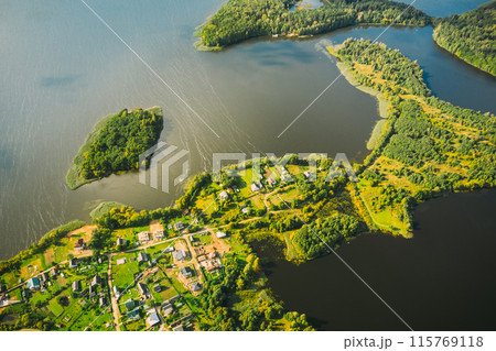 Lyepyel District, Lepel Lake, Beloozerny District, Vitebsk Region. Aerial View Of Residential Area With Houses In Countryside. Top View Of Island Pension Lode From High Attitude In Autumn Sunny Day Lyepyel District, Lepel Lake, Beloozerny District, Vitebsk Region. Aerial View Of Residential Area With Houses In Countryside. Top View Of Island Pension Lode From High Attitude In Autumn Sunny Day 115769118