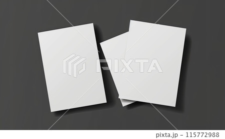 Three white business cards stacked on black surface 115772988