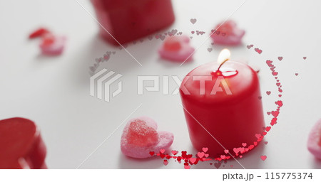 Image of multiple red hearts over red candles Image of multiple red hearts over red candles 115775374