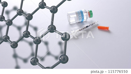 Molecular structure model over syringe and vaccine vial on white background Molecular structure model over syringe and vaccine vial on white background 115776550