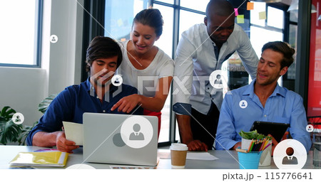 Image of profile icons over diverse coworkers discussing reports on laptop and digital tablet 115776641