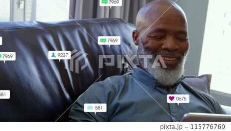 Image of notification bars over senior african american man using digital tablet at home Image of notification bars over senior african american man using digital tablet at home 115776760