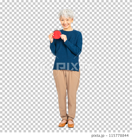 Senior woman smiling while holding a wallet. Full-body photo PNG with transparent background precisely cut out by hand. Senior woman smiling while holding a wallet. Full-body photo PNG with transparent background precisely cut out by hand. 115778844