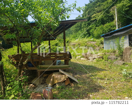 a small house on a construction site 115782211