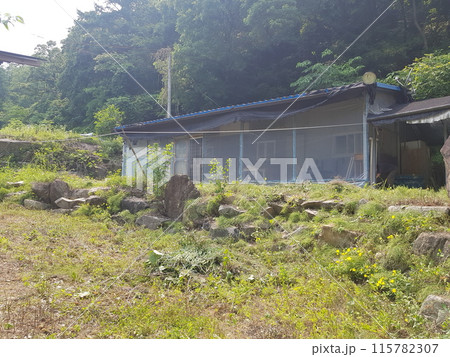 a small house on a construction site 115782307