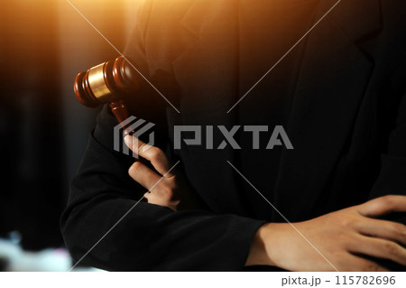 Law theme, gavel or mallet of the judge, lawyer enforcement officers, evidence-based cases taken into account in the court abount business, legislation. 115782696