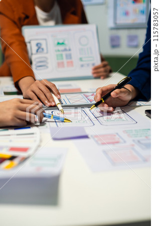 UX developer and ui designer brainstorming about mobile app interface wireframe design with customer breif and color code, User experience concept.. 115783057