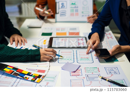UX developer and ui designer brainstorming about mobile app interface wireframe design with customer breif and color code, User experience concept.. UX developer and ui designer brainstorming about mobile app interface wireframe design with customer breif and color code, User experience concept.. 115783060