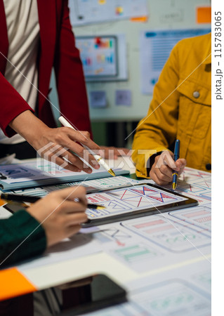 UX developer and ui designer brainstorming about mobile app interface wireframe design with customer breif and color code, User experience concept.. UX developer and ui designer brainstorming about mobile app interface wireframe design with customer breif and color code, User experience concept.. 115783065