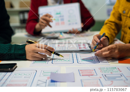 UX developer and ui designer brainstorming about mobile app interface wireframe design with customer breif and color code, User experience concept.. UX developer and ui designer brainstorming about mobile app interface wireframe design with customer breif and color code, User experience concept.. 115783067