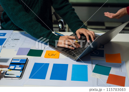 UX developer and ui designer brainstorming about mobile app interface wireframe design with customer breif and color code, User experience concept.. UX developer and ui designer brainstorming about mobile app interface wireframe design with customer breif and color code, User experience concept.. 115783083