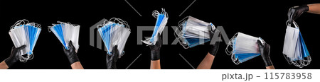 Hand in black gloves wearing disposable face mask isolated on black background Hand in black gloves wearing disposable face mask isolated on black background 115783958