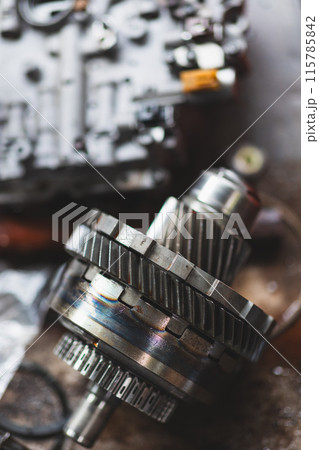 Closeup Motor Engine Clutch Gear, Auto Garage Motor racing part service workshop. vertical shot. 115785842