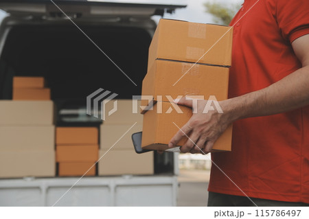 Asian delivery express courier young man use giving boxes to woman customer he wearing protective face mask at front home Asian delivery express courier young man use giving boxes to woman customer he wearing protective face mask at front home 115786497