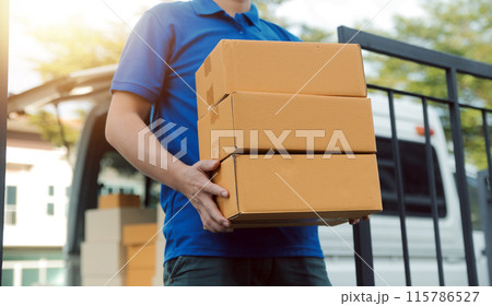 Asian delivery express courier young man use giving boxes to woman customer he wearing protective face mask at front home 115786527