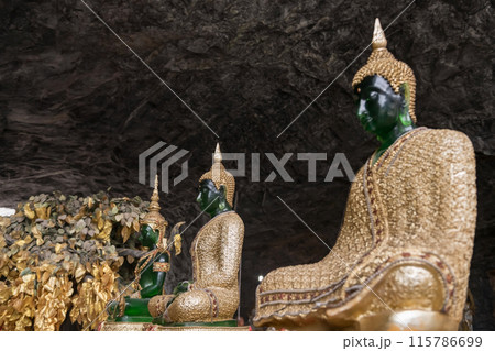 3 Emerald Buddha statues with golden robe and tree, Suphan Buri cave 3 Emerald Buddha statues with golden robe and tree, Suphan Buri cave 115786699