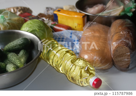 Fresh products delivery service. Donation of bread and vegetables. Oil and vegetables supply concept. Groceries delivery background 115787986