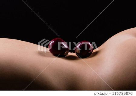 Close up of woman back with laying onion, low key 115789870