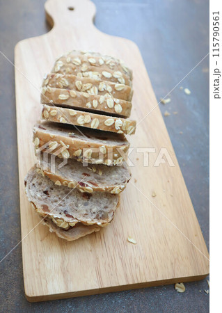 bread , whole wheat bread or sourdough bread or loaf of bread or cranberry and whole grain bread in the tray 115790561