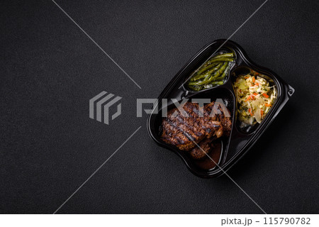 Fresh juicy delicious beef steak on a dark background 115790782