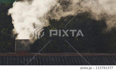 White smoke from the chimney of the village house. White smoke from the chimney of the village house. 115791377