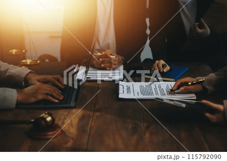 Judge gavel with Justice lawyers having team meeting at law firm background. Concepts of Law and Legal services. Judge gavel with Justice lawyers having team meeting at law firm background. Concepts of Law and Legal services. 115792090