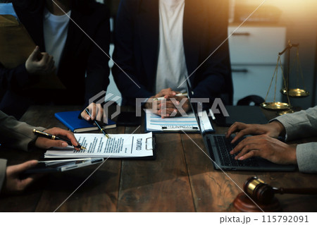 Judge gavel with Justice lawyers having team meeting at law firm background. Concepts of Law and Legal services. Judge gavel with Justice lawyers having team meeting at law firm background. Concepts of Law and Legal services. 115792091