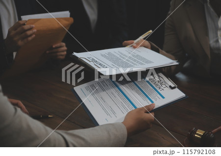 Judge gavel with Justice lawyers having team meeting at law firm background. Concepts of Law and Legal services. 115792108