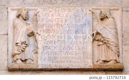 The prophets Enoch and Elijah hold the epigraph with the foundation date of the temple and the name of Wiligelmo, Modena Cathedral, Italy The prophets Enoch and Elijah hold the epigraph with the foundation date of the temple and the name of Wiligelmo, Modena Cathedral, Italy 115792718