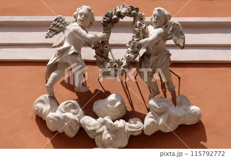 Angels, statue on the portal of St. Barnabas Church in Modena, Italy Angels, statue on the portal of St. Barnabas Church in Modena, Italy 115792772