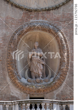Virgin Mary statue on Clock tower of Palace of Reason (Palazzo della Ragione with the Torre dell'Orologio) in Mantua, Italy Virgin Mary statue on Clock tower of Palace of Reason (Palazzo della Ragione with the Torre dell'Orologio) in Mantua, Italy 115792786