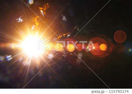 Abstract imitation sun starlight distant galaxy on a black background. 115793174