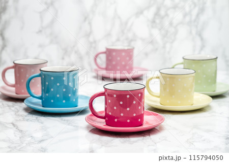 Colorful Ceramic Mugs with White Dots, Artistic Arrangement, Vibrant Colors, Unique Perspective 115794050